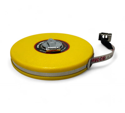 30m closed reel fibreglass tape measure displayed coiled with protective case for precise distance measuring in trade environments
