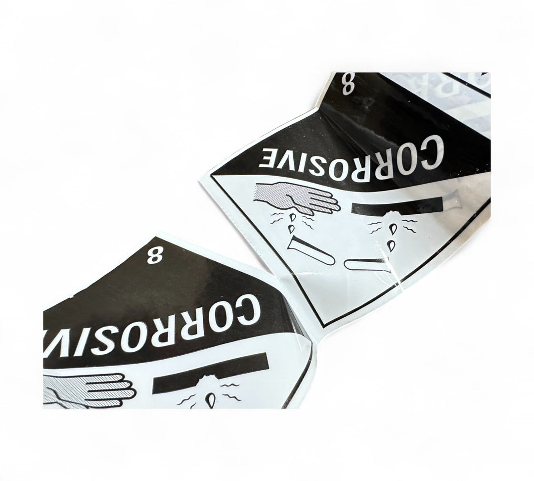 Corrosive 8 Rip A Label 96 x 100mm x 50m black on white displayed stacked for regulatory use in hazardous material handling