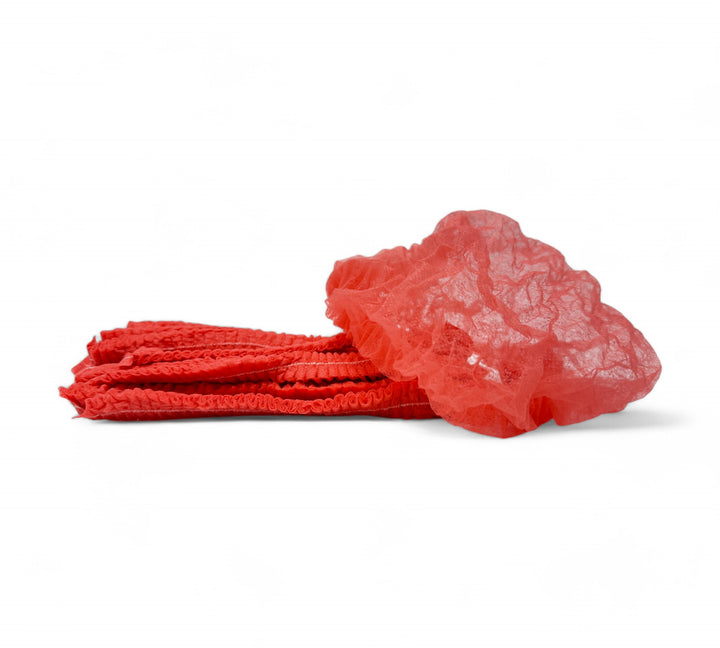 Red crinkled mop cap hair nets shown packed for high-volume use in food processing or cleanroom environments