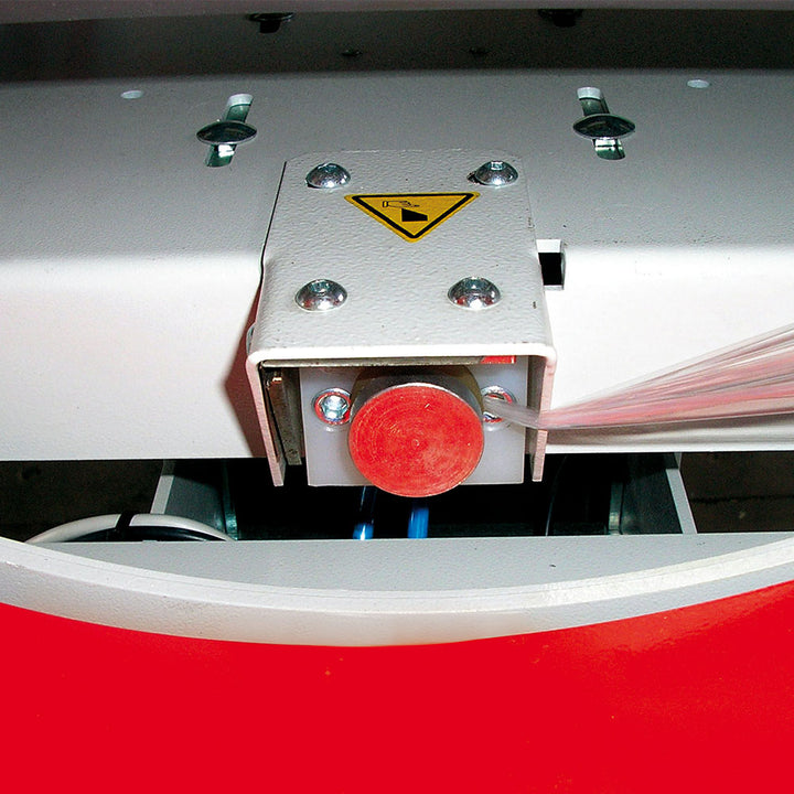 Close-up of the Evoring-A horizontal wrapper's automated film clamp and cutting claw mechanism for secure film handling during wrapping cycle