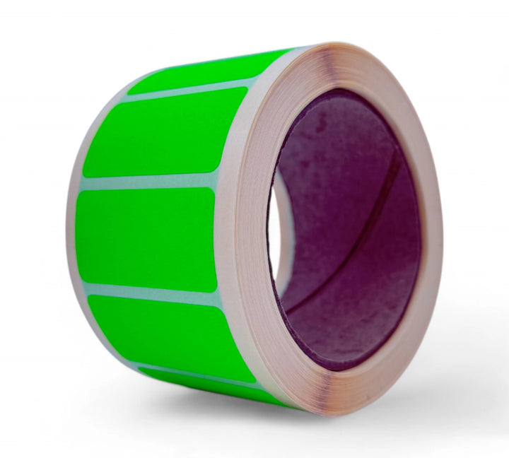 Compact 50 x 25mm fluro green label rolls displayed in bulk ideal for SKU marking, safety signage, or sorting tasks