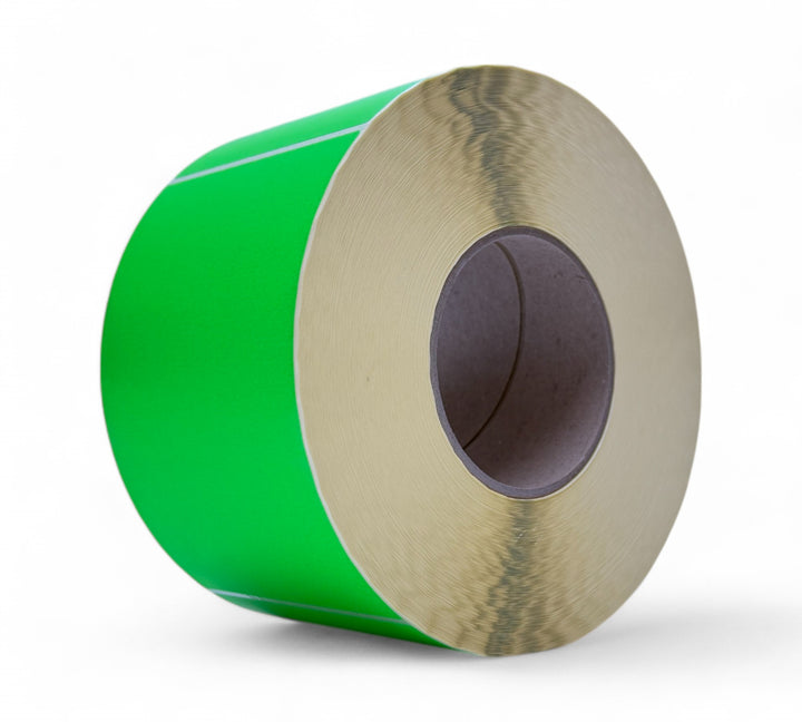 Fluro green 100 x 150mm thermal transfer labels with perforation stacked in rolls for warehouse and dispatch labelling