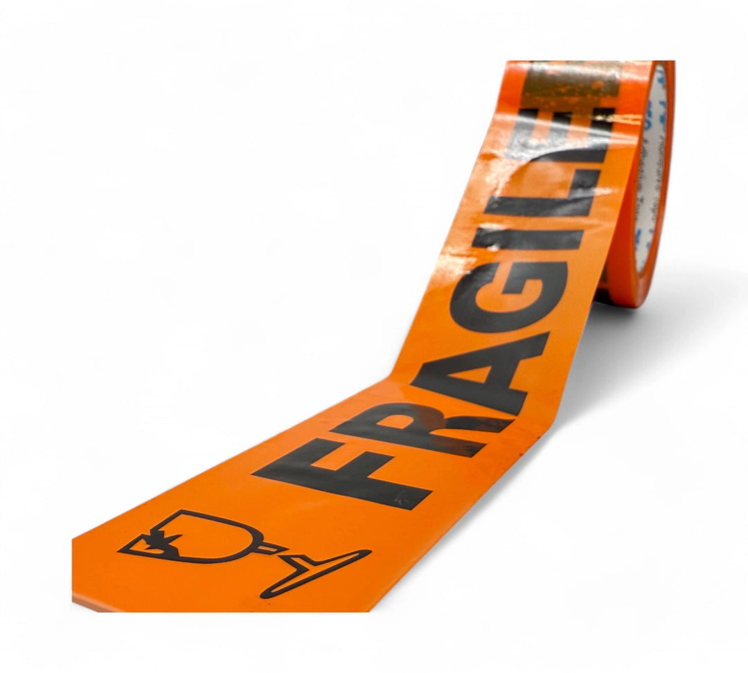 Close-up of a roll of orange adhesive packaging tape with bold black ÒFRAGILE text and a broken glass symbol, partially unrolled on a white background.

