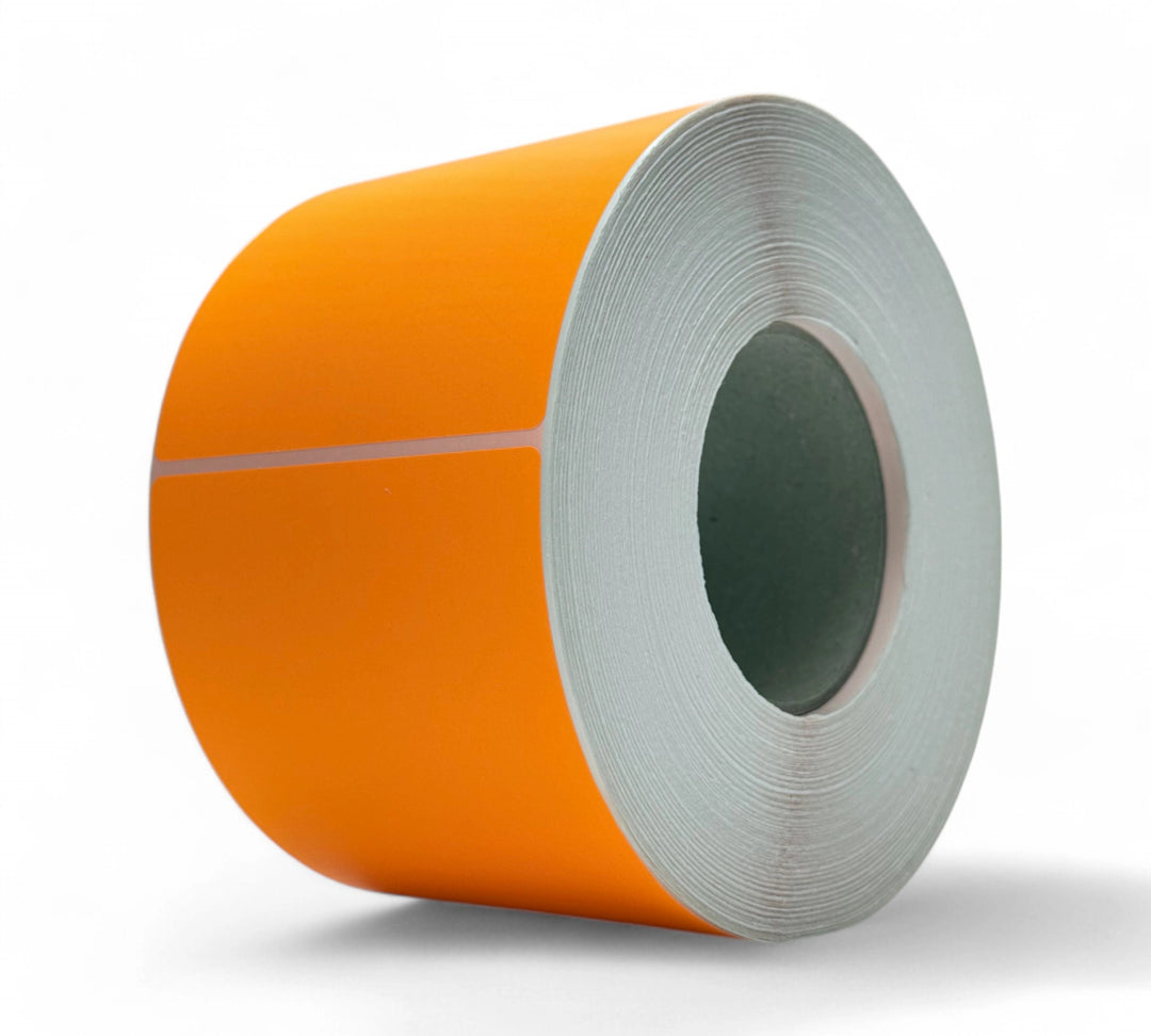 Fluro orange 103 x 124mm thermal transfer labels shown rolled for use in freight, inventory, or warning indicators
