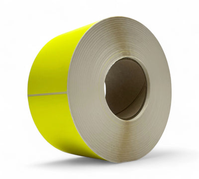 Fluro yellow 85 x 150mm label rolls shown rolled for high-visibility stock management or hazard labelling