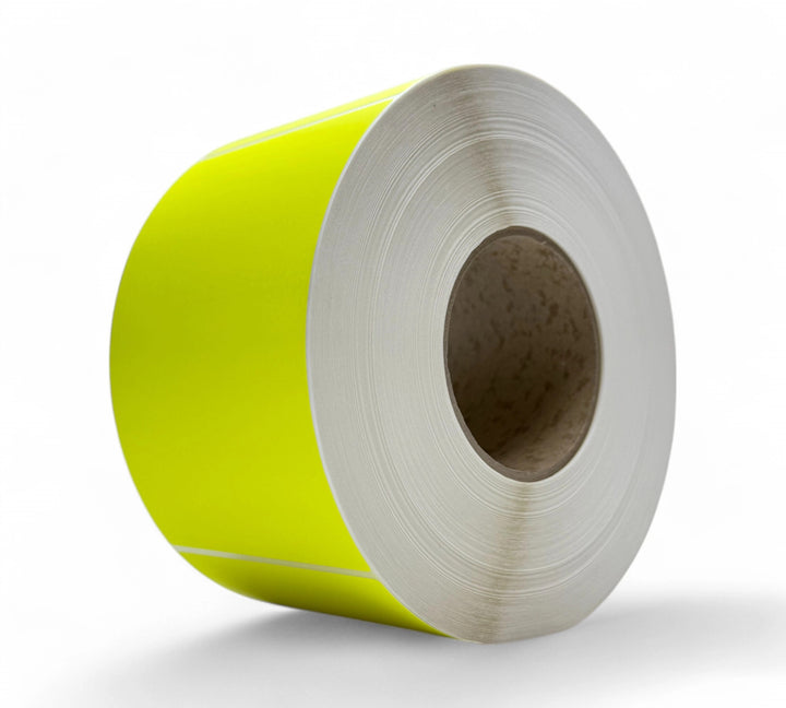 Fluro yellow 100 x 150mm thermal labels with perforation displayed in compact rolls for high-speed thermal printers