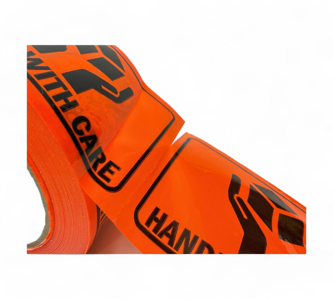 Close-up of perforated Handle With Care label with bold black print on fluro orange for easy tear-off