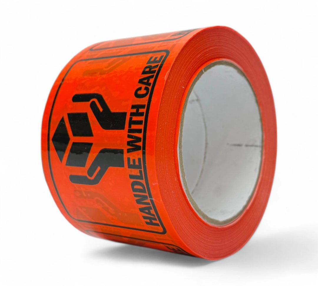 Handle With Care 75 x 100mm black print on fluro orange Rip A Label rolls shown for bold warning and fragile goods labelling