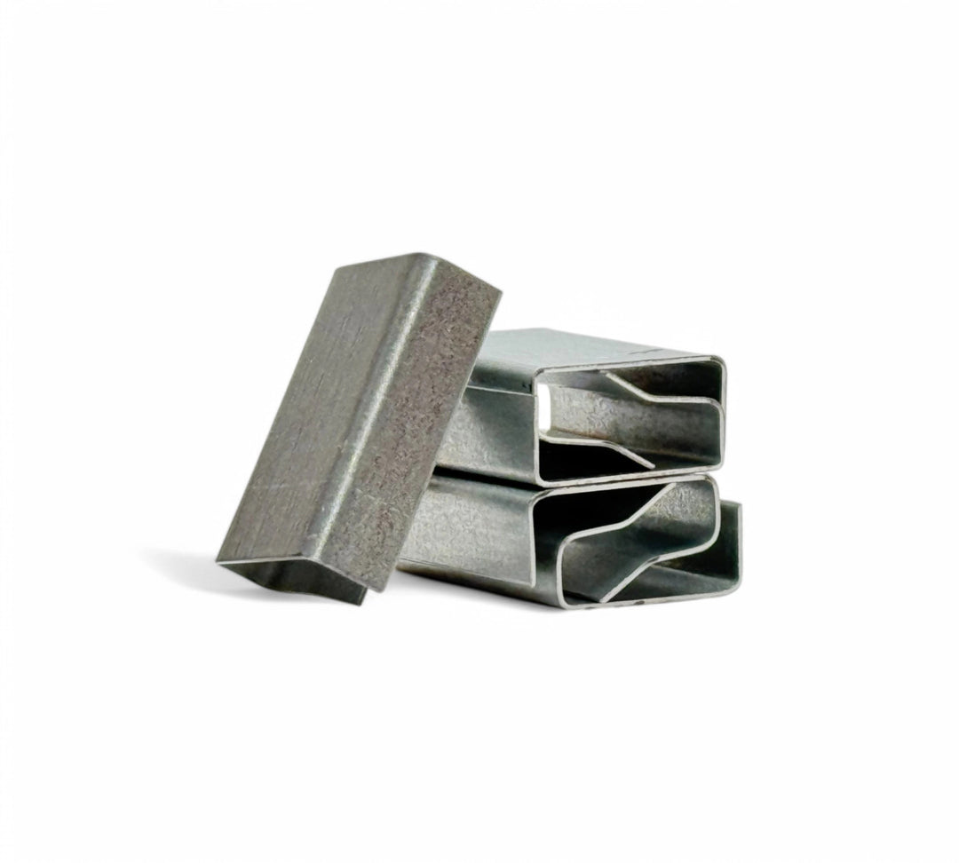 19mm PNSC metal seals shown stacked in bulk for securing heavy-duty poly or PET strapping in palletised freight