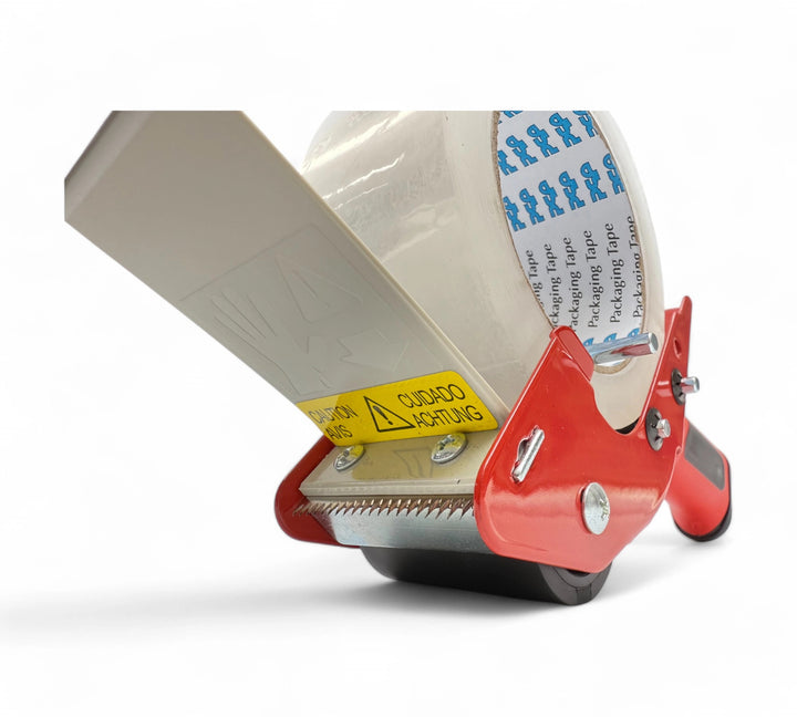 Close-up of 48mm 'Rat Trap' pistol grip tape dispenser blade with safety shield and serrated cutter for precision sealing