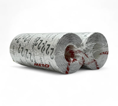 Plain white 26 x 16mm Meto label rolls shown compactly stacked for price labelling in retail and inventory systems
