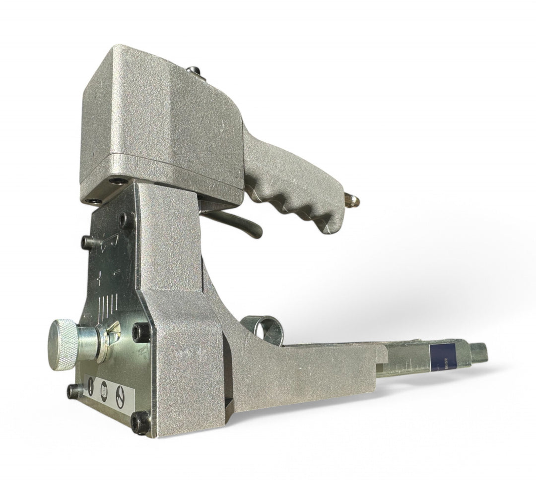Pneumatic carton stapler displayed with ergonomic handle for high volume box sealing in industrial or warehouse settings