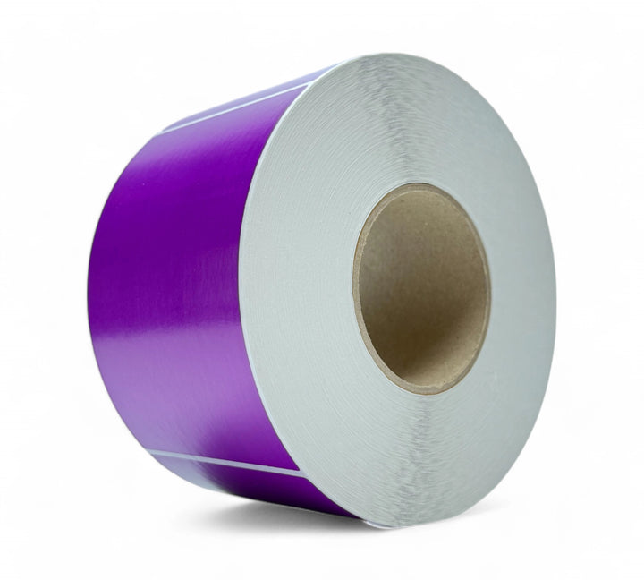 Purple 100 x 150mm thermal transfer labels shown in rolls for use in barcode printing and colour-coded dispatch zones