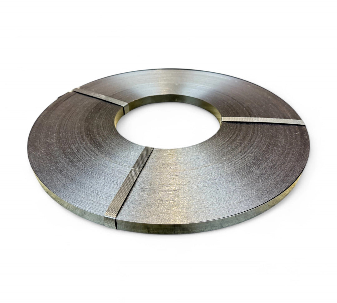 Ribbon wound steel strap 12.7mm x 0.5 shown coiled for heavy-duty bundling of industrial loads