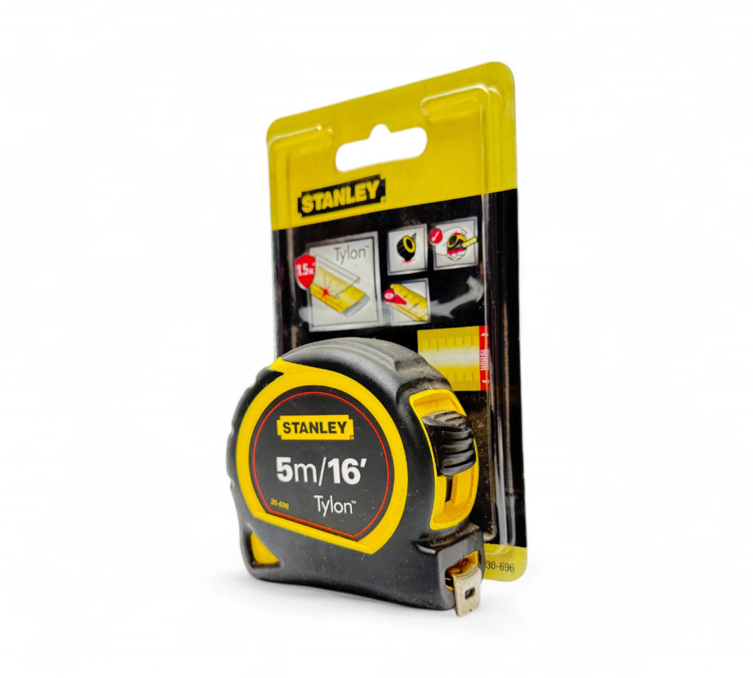 Stanley 5m tape measure displayed retracted with belt clip and impact-resistant casing for on-site measuring