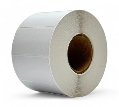 White 60 x 30mm direct thermal label rolls shown compactly wound for barcode and price label applications