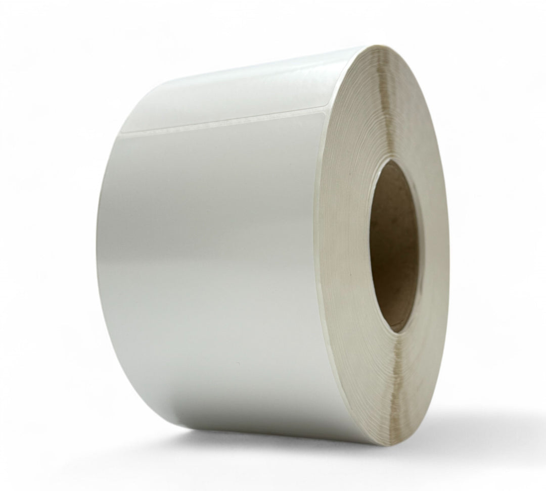 White synthetic 100 x 150mm thermal transfer labels rolled for durable labelling on smooth or uneven surfaces