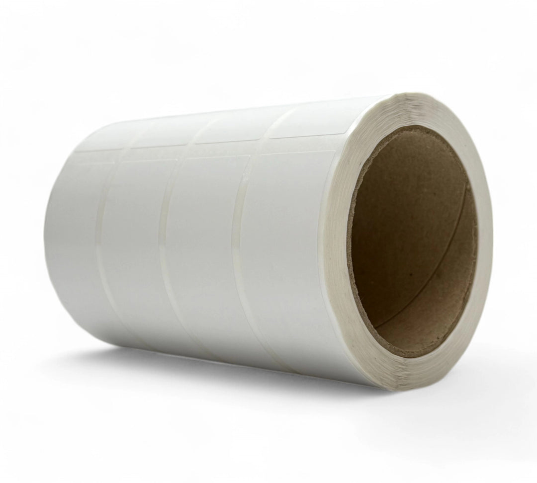 White 34 x 99mm thermal transfer labels shown in clean square-edge rolls for product tracking and barcode systems