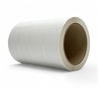 White 34 x 99mm thermal transfer labels shown in clean square-edge rolls for product tracking and barcode systems