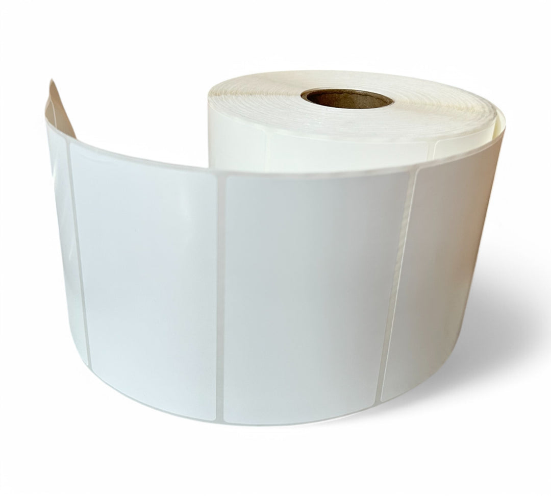Roll of white thermal synthetic labels 102x62mm standing upright for barcode and shipping applications