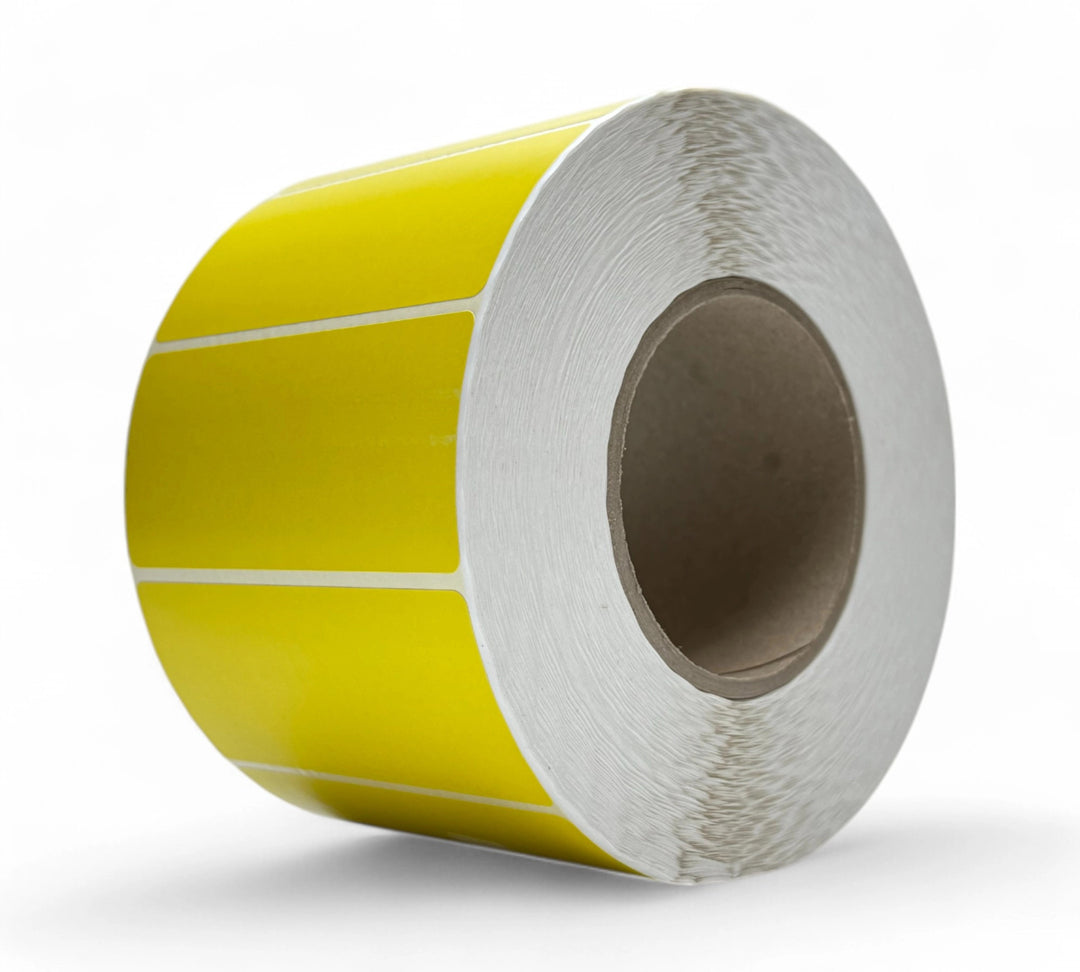 Compact yellow 100 x 45mm direct labels shown in dense rolls ideal for barcode and date marking in bulk packaging